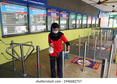 BANDAR SUNWAY, MALAYSIA - MARCH 05, 2021 : Worker Do Sanitizer At Ticket Counter And Theme Park Area To Ready For Reopen.