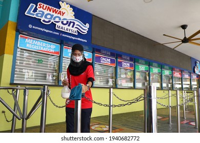 BANDAR SUNWAY, MALAYSIA - MARCH 05, 2021 : Worker Do Sanitizer At Ticket Counter And Theme Park Area To Ready For Reopen.