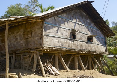 BANDARBAN, BANGLADESH - FEBRUARY 20, 2014: Unidentified women look from the windows of the traditional Marma hill tribe house in Bandarban, Bangladesh. 