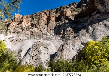 Bandelier National Monument in New Mexico. Hot ash from volcano at Valles Caldera cooled and welded into rock called tuff. Pajarito Plateau and Frijoles Canyon show Volcanic Geology. Pueblo Loop Trail Stock photo © 