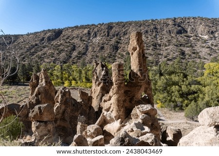 Bandelier National Monument in New Mexico. Hot ash from volcano at Valles Caldera cooled and welded into a rock called tuff. Pajarito Plateau and Frijoles Canyon show Volcanic Geology.  Stock photo © 