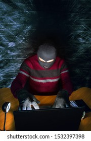 A Bandit In A Mask Of A Balaclava Using A Laptop Does Not Fair Profit On The Internet