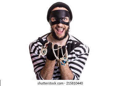 Bandit Showing Stolen Jewelry And Smiling. Portrait Isolated On White Background 