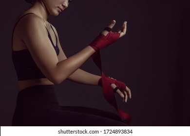 Bandung, Indonesia. 1 July 2019. a female model wearing boxing wrap and doing a photo shoot in the studio.