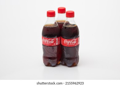 Bandung, Indonesia, 2022-05-14, three plastic bottle of coca cola soft drink