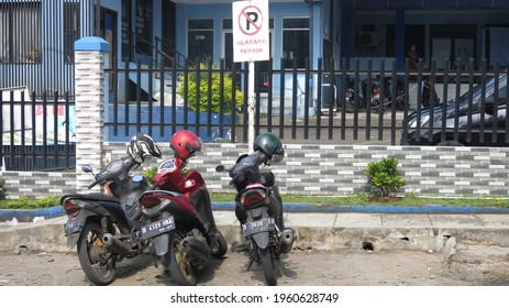 Bandung, Indonesia - April 18 2021 : Motorcycle Illegal Parking In No--parking Zone Sign