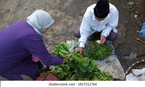 Bandung, Indonesia - April, 2020: People Transaction Buying Vegetables In Wet Market, Bandung City, Indonesia.