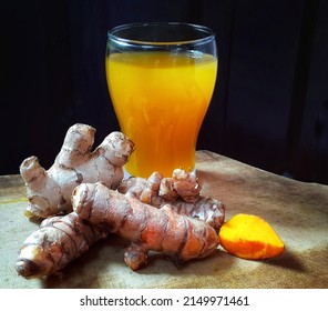 Bandung Indonesia, April 2022 - tumeric roots and a glass of fresh turmeric tea drink