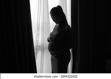 BANDUNG, Indonesia - January 13, 2021: a happy woman with a baby in her stomach Bandung, Indonesia On January  - Shutterstock ID 1894323502