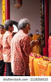 Bandung, Indonesia - January 8, 2022: Old People Praying Peacefully On Buddhist Temple At Buddhist New Year