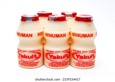 BANDUNG, INDONESIA – MAY 22,  2022 Yakult, Yogurt-like Probiotic Drink Made From Fermented Skim Milk And Sugar With Lactobacillus Casei Bacteria.  Yakult On A White Background