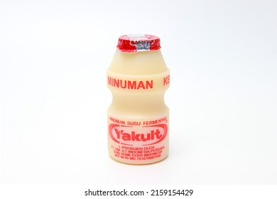 BANDUNG, INDONESIA – MAY 22,  2022 Yakult, Yogurt-like Probiotic Drink Made From Fermented Skim Milk And Sugar With Lactobacillus Casei Bacteria.  Yakult On A White Background