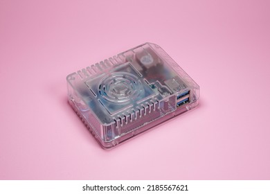 Bandung, Indonesia - Mei 02, 2022: Odroid is a single board computer has USB, HDMI and LAN port. Mini computer with transparent plastic case on pink background isolated.