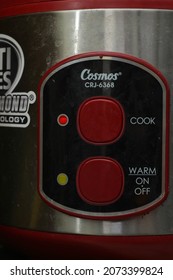 Bandung, Indonesia, Oct  20 2021: The Red Rice Cooker Button On Branded Products. Close Up Image. 