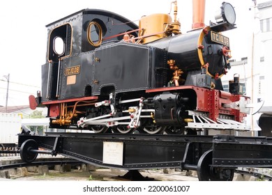 Bandung, Indonesia - September 9th 2022 : An Old Model Of Locomotive Of Train In Front Of Bandung Railway Station Or Stasiun Kereta Api Bandung