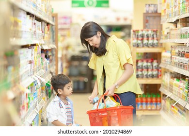 Bandung - West Java
August 19, 2016
Indonesia

Asian Mom Shows A Product To Be Bought To Her Son