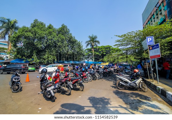 Bandung, West Java / Indonesia - July 25th 2018:\
Parked Cars in the Parking\
Lot