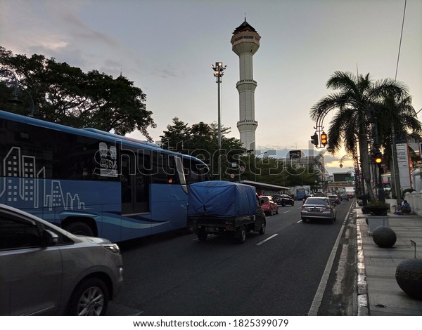 \
Bandung, West Java / Indonesia - Oct\
1, 2020: blue bus driving beside the Alun alun\
Bandung