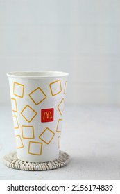 Bandung,Indonesia may15-2022:cold drink served in a white glass, one of the products of mac donalds,blurred background