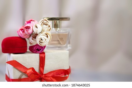 Baner gift for the holiday Valentine's Day. perfume, flowers, jewelry box. Love and gifts concept