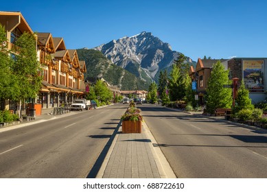 BANFF, ALBERTA, CANADA - JUNE 27, 2017 : Scenic street view of the Banff Avenue in a sunny summer day. Banff is a resort town and popular tourist destination.
