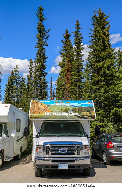 BANFF, CANADA - JULY 28, 2014: RV in\
Banff National Park. Banff National Park is Canada\'s oldest\
national park, established in 1885 in the Rocky\
Mountains