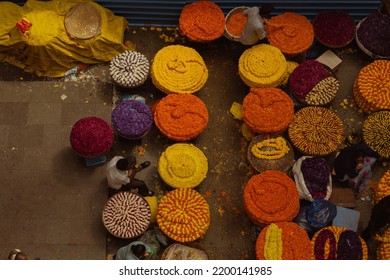 Bangalore, India -14-08-2021:Top View Of K.R. Market Flower Vendors. Flower Vendor Holding Tea.