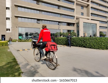 Bangalore, India 2020 : Zomato Delivery Boy Riding A Bicycle To Deliver The Food Order, Leading Online Food Delivery Startup In Foodtech Space. Zomato Competes With Swiggy, Foodpanda And Uber Eats