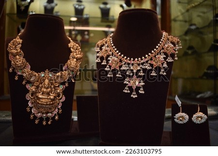 Bangalore, India 31st January 2023: Traditional Gold ornaments with marvelous stones and intricate designs. Temple gold jewellery.