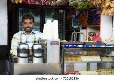 BANGALORE, INDIA - APRIL 12, 2016: A Man Selling Chai (indian Tea) Standing At His Shop In The Train Station 