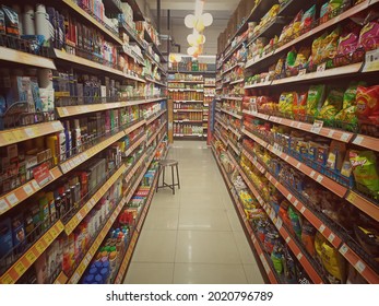 BANGALORE, INDIA - Jul 31, 2021: A View Of An Aisle With Racks And Shelves Filled With FMCG  In A Super Market