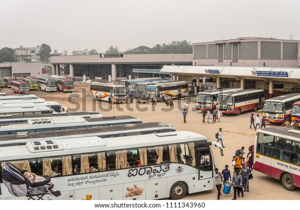 Bangalore, India, May 26,\
2018, Majestic Bus Station in Bengaluru, old Indian buses,\
traveling Indians\
Hindus