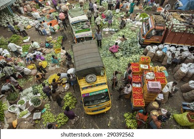 BANGALORE, INDIA - May 27, 2014: Aerial View Of The Crowded City Market, Vendors Sell Vegetables, Vehicles Move Through The Crowd