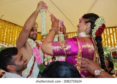  Bangalore, Karnataka, India-November 21 2021;An Indian Wedding ritual where the Bride and the Groom are exchanging floral garlands in traditional Brahmin culture in Bangalore, India.
