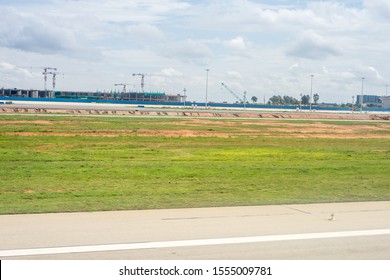 Bangalore To Pune,, A Large Air Plane On A Runway At An Airport