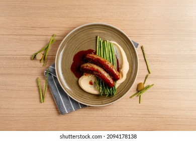 Bangers And Mash food with vegetables, Herbs, and Gravy Top View