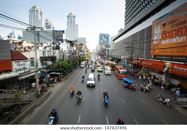 BANGKOK - APRIL 23: Busy road in the city center\
near the Baiyoke Sky hotel on April 23, 2012 in Bangkok, Thailand.\
Annually an estimated 150,000 new cars join the heavily congested\
roads of Bangkok.
