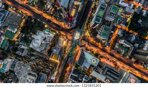Bangkok City aerial view, Aerial\
view from above of skyscraper and traffic in Bangkok,\
Thailand.
