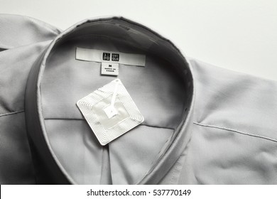 BANGKOK - DEC, 17: The Brand Name Menswear Shirt And Rfid Tag Represent The Fashion Retail Business And Technology On December 17, 2016 In Bangkok, Thailand.