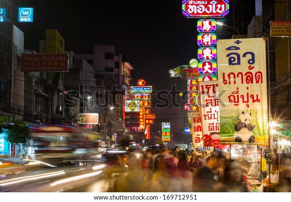 BANGKOK - DECEMBER 29: The\
China Town of thailand on Yaowarat Road at night time. Multicolor\
light from building\'s advertise and car at night, Thailand on\
December 29, 2013.