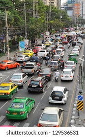 BANGKOK - FEB 8: Traffic nears gridlock on a busy road in the city centre on Feb 8, 2013 in Bangkok, Thailand. Annually an estimated 150,000 new cars join the heavily congested roads of Bangkok.