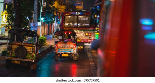 BANGKOK - FEBRUARY 18: Night ride a on public bus with tuk-tuks and a public bus view on February 18, 2017 in Bangkok, Thailand. - Shutterstock ID 595709501