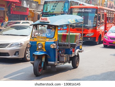 BANGKOK - FEBRUARY 20: Tuk-tuk Moto Taxi On The Street In The Chinatown Area On February 20, 2012 In Bangkok. Famous Bangkok Moto-taxi Called Tuk-tuk Is A Landmark Of The City And Popular Transport.