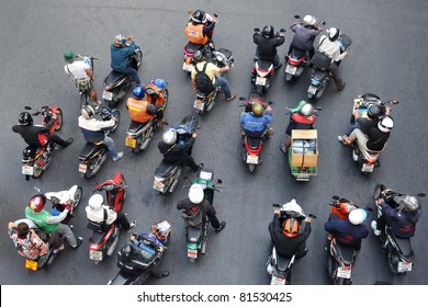 BANGKOK - JAN 13: Motorcyclists wait at a junction  during rush hour on Jan 13, 2011 in Bangkok, Thailand. Motorcycles are often the transport of choice for Bangkok's heavily congested roads.