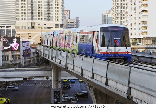BANGKOK - JANUARY 7: BTS Skytrain speeds through\
the city center January 7, 2011 in Bangkok, Thailand. The mass\
transit rail network recently marked its 10th year of service in\
the Thai capital.