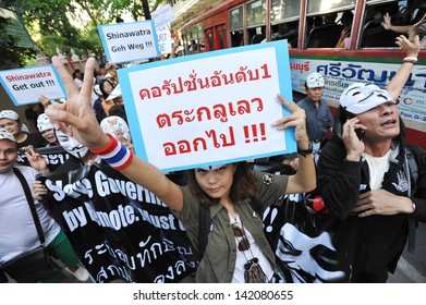 BANGKOK - JUN 9: A protester joins an anti-government rally in Bangkok's shopping district on Jun 9, 2013 in Bangkok, Thailand. The protesters call for the government to be overthrown.