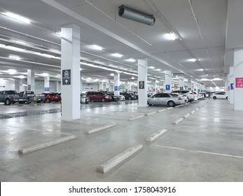 Bangkok - June 17,2020 : Car parking in the area in HomePro at Fashion Island Shopping Mall , Ramintra Rd., Khannayao Bangkok Thiland. Indoor parking in shopping center with lighting