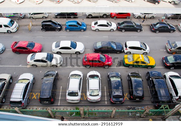 BANGKOK- JUNE  28 :Cars parked at a park and\
side lot at a BTS station in Chatuchak district on June 28,2015 in\
Bangkok,Thailand.The government has promoted park and ride to\
reduce traffic\
congestion.