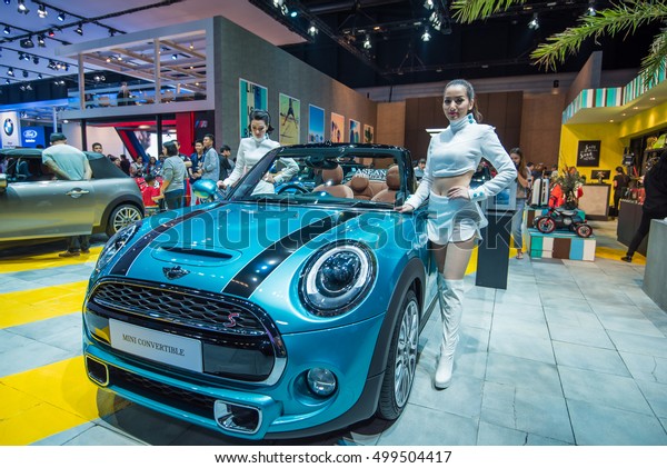 BANGKOK - March 27, 2016\
: Unidentified model with Mini Cooper car on display at the 37th\
BANGKOK INTERNATIONAL MOTOR SHOW 2016 on March 27, 2016 in Bangkok,\
Thailand. 