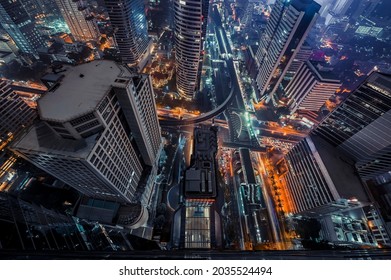 Bangkok Night Life With Illuminated Cityscape On Skyscraper